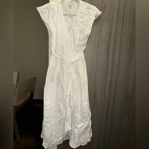 White, open back, long ruffle dress.